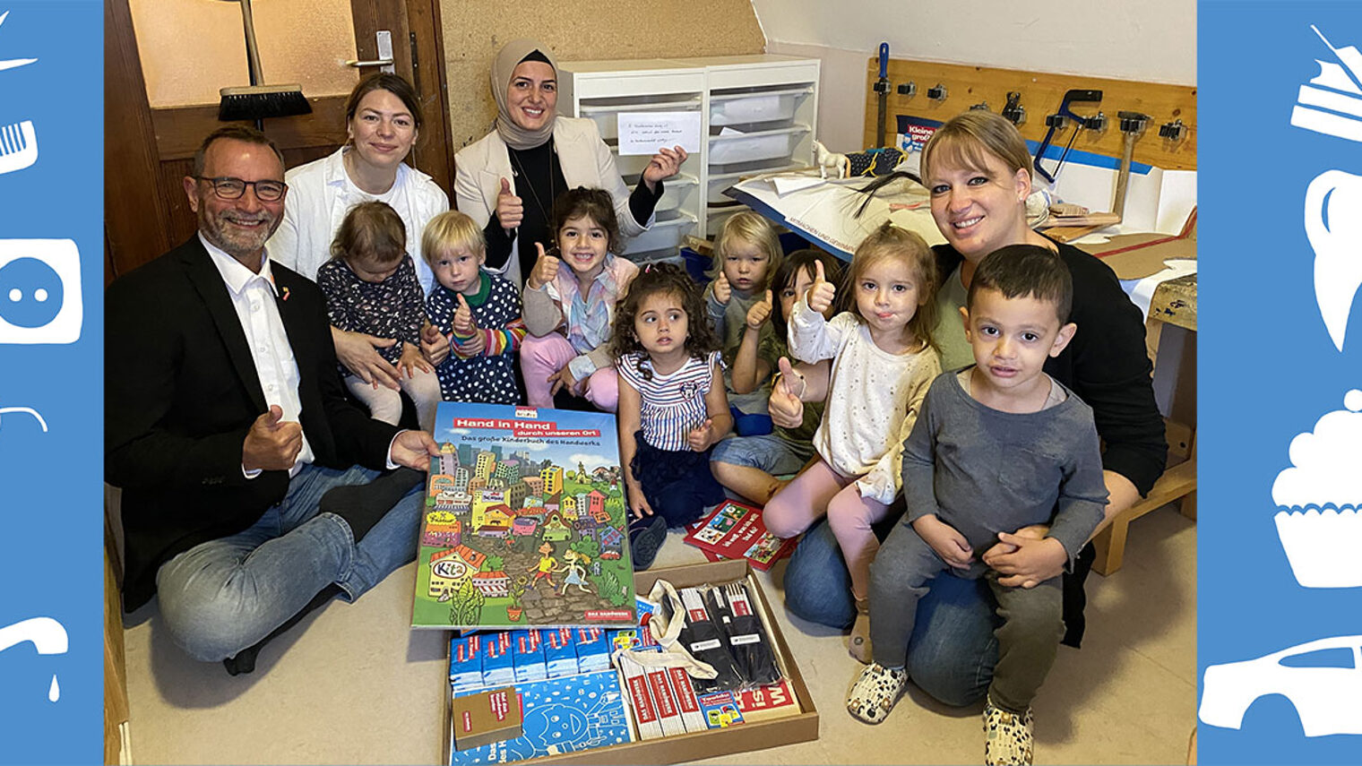 Martin Strobl, Kreishandwerksmeister für Würzburg, mit Kindern und Erzieherinnen des Familienzentrum Würzburg e.V. 
